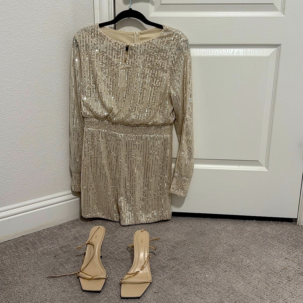 Size 10  Sequence romper. Champagnes gold. Worn just once for about 10 minutes